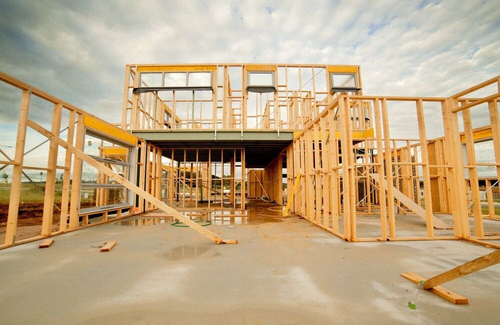 A building under construction with wooden frames.